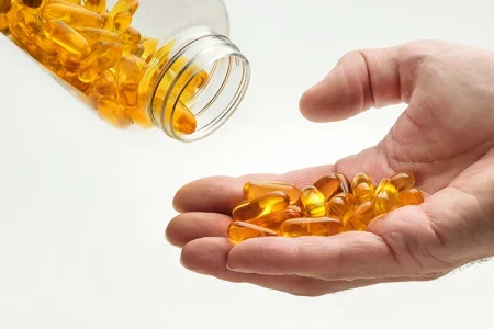 A person pouring ACTRA-Sx dietary supplement