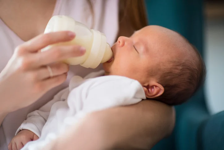 Mother feeding a baby