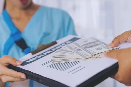 A patient paying a hospital bill