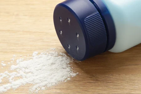 Spilling baby powder on a desk