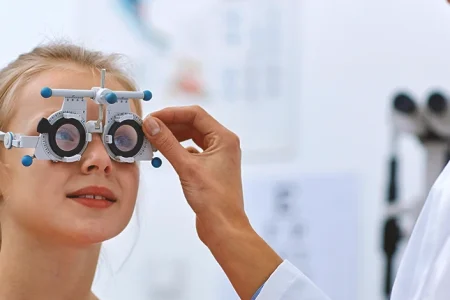A doctor checking a patient for blindness and vision loss