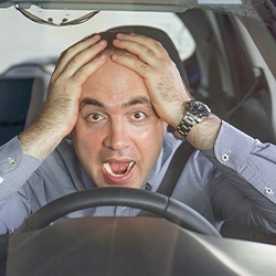 Shocked man in driving seat 