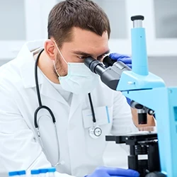 A doctor using a microscope