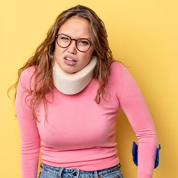 Injured woman in pink sweater going to work