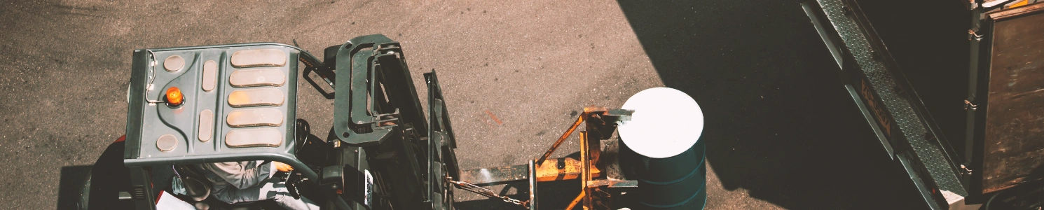 A forklift lifting a barrel