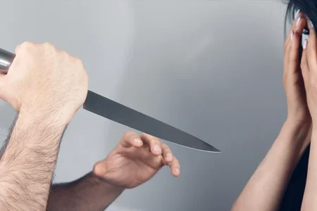 A man holding a knife trying to commit murder