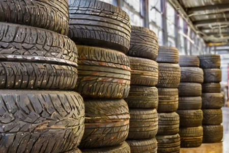 A pile of Cooper Tires on a shop