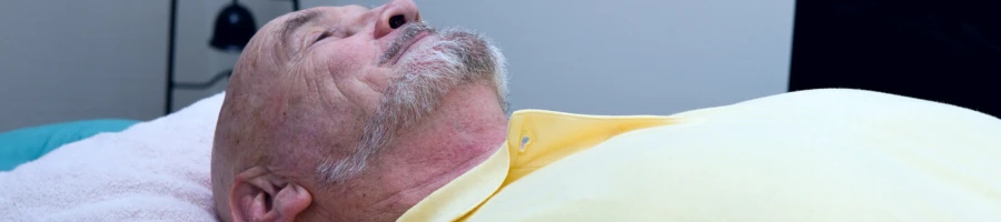 Man laying on doctors bed