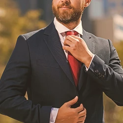 A lawyer outside fixing his tie