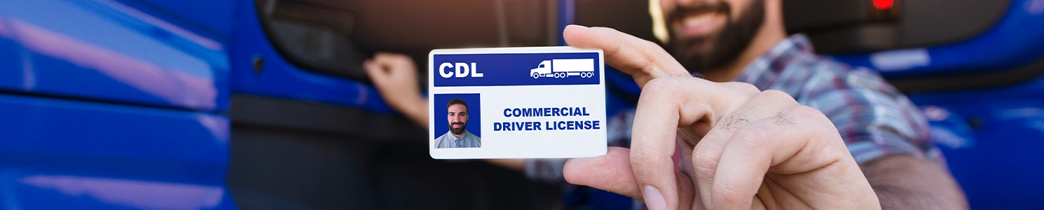 Close up image of a driver showing his commercial license