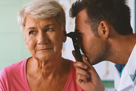 An ENT doctor checking up on a patient