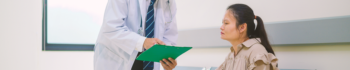 A doctor talking to a patient inside the hospital