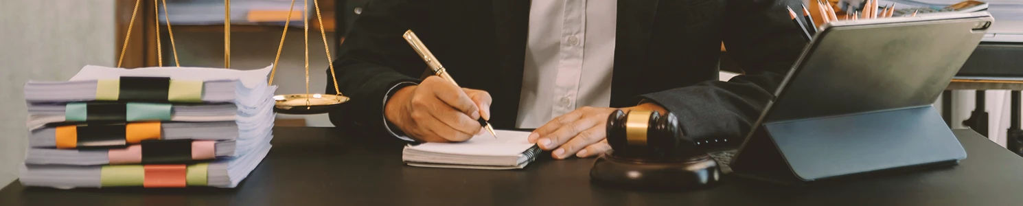 A lawyer writing down the amount received from a glyphosate lawsuit