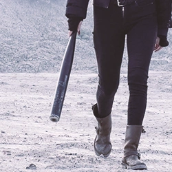 A person holding a bat outside