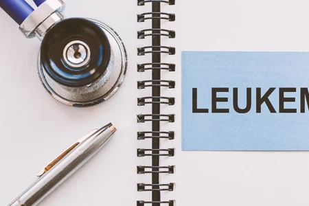 A doctor's stethoscope on a notepad with leukemia written