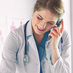 A doctor calling someone on the phone