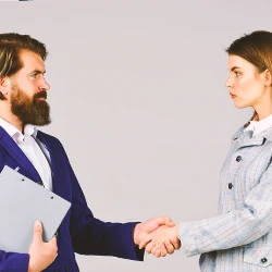 Two business people shaking hands