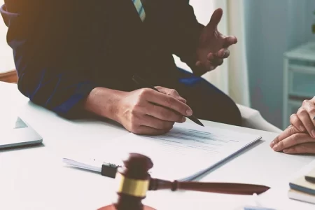Two businessmen talking at a table