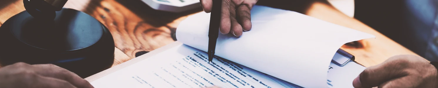 A lawyer pointing to paperwork