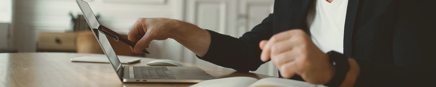 A lawyer pointing to a laptop screen