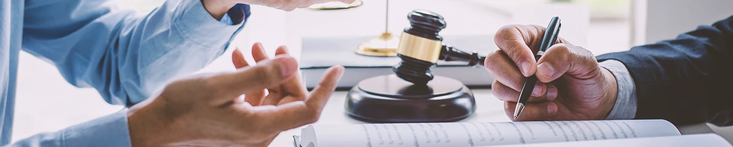 A lawyer and a client discussing at an office table