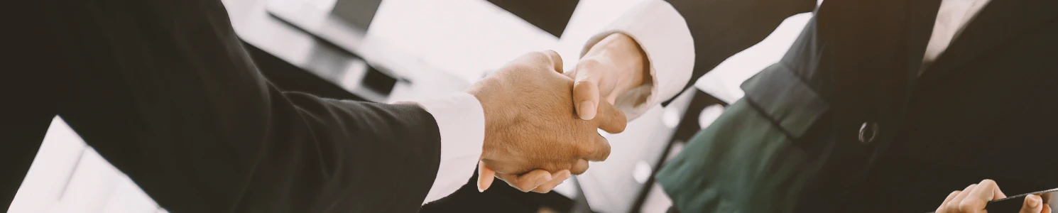 A lawyer and a client shaking hands