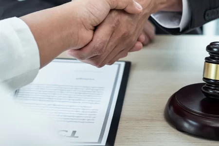 Client and lawyer shaking hands