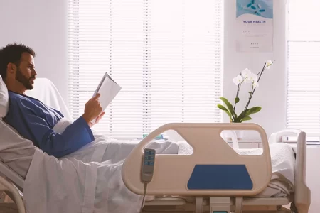 A patient in a hospital reading a book