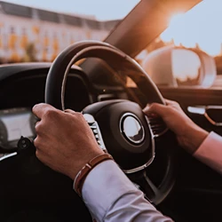 A man holding the steering wheel both hands