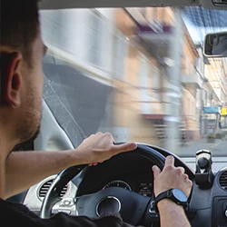 A man driving his car with impaired vision