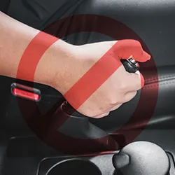 Pulling the hand brake of a car with 'Prohibited sign' overlay