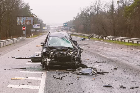 A crashed car in the middle of the road