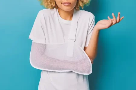 An injured person with her hand in a cast