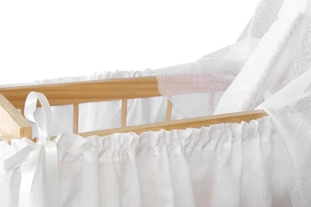A white Kolcraft Bassinet for babies