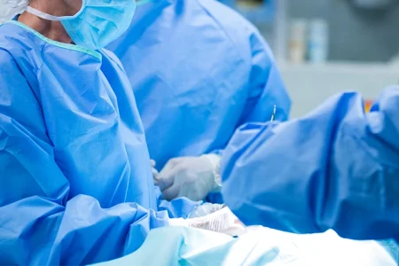doctors preparing for an operation with hernia mesh
