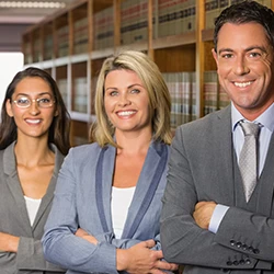 An image of three lawyers in a library