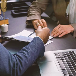 A lawyer and client discussing a contract