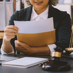 A lawyer checking paperwork in an office