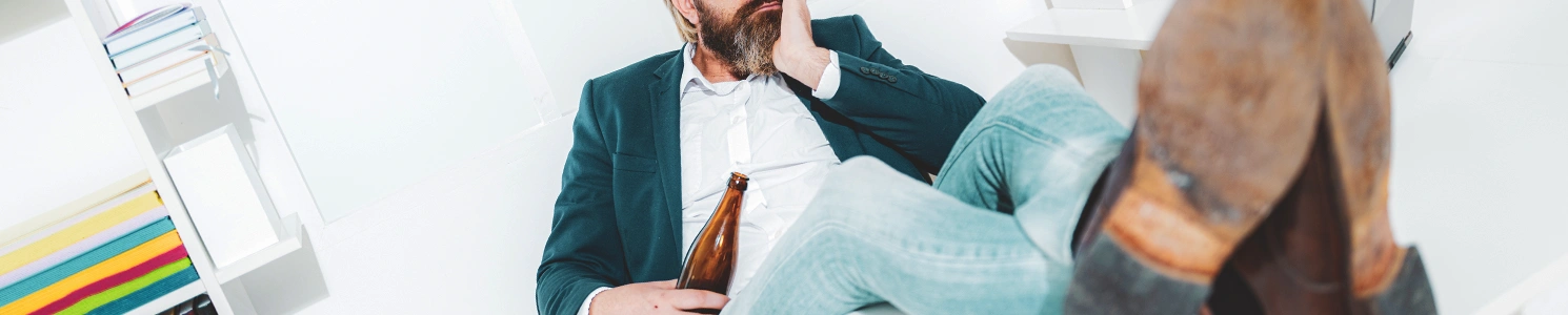 An office worker drinking inside the office