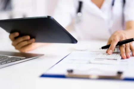 Woman looking at medical bills