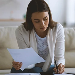 A person computing medical bills