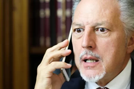 Upset lawyer talking on phone