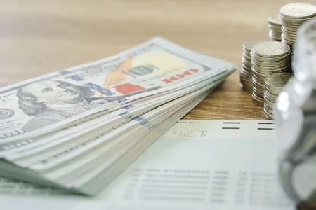Money on a desk that is considered as non-discretionary bonus