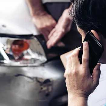 Driver calling his Car's insurance company 