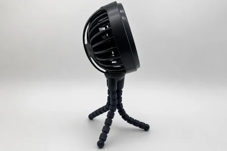 Black Nuby stroller fan with flexible tripod legs displayed against a light gray background.