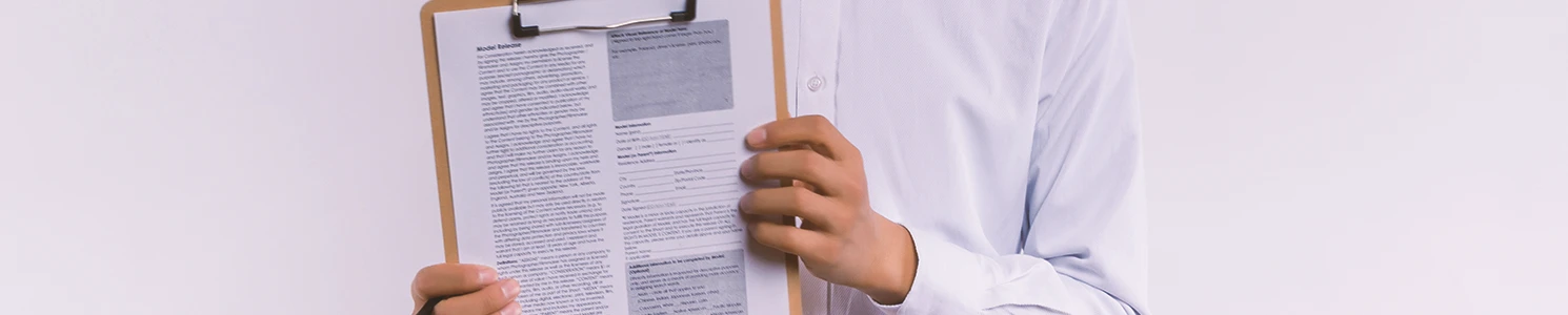 A doctor holding a clipboard of health issues with glyphosate