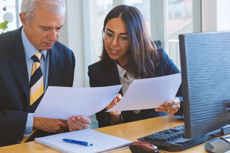 A paralegal and a legal secretary talking to eachother