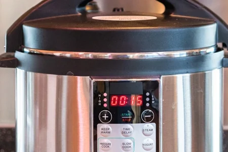 A close up shot of an electric pressure cooker