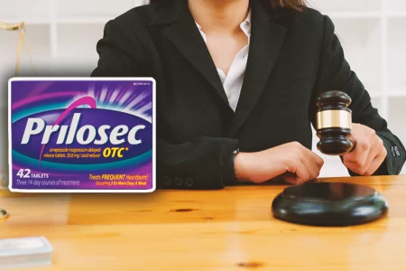 A lawyer with Prilosec in the foreground