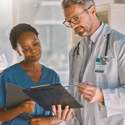 A doctor and nurse discussing the reasons for the recall of glyphosate